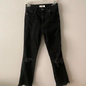 Black jeans with rip in the knees